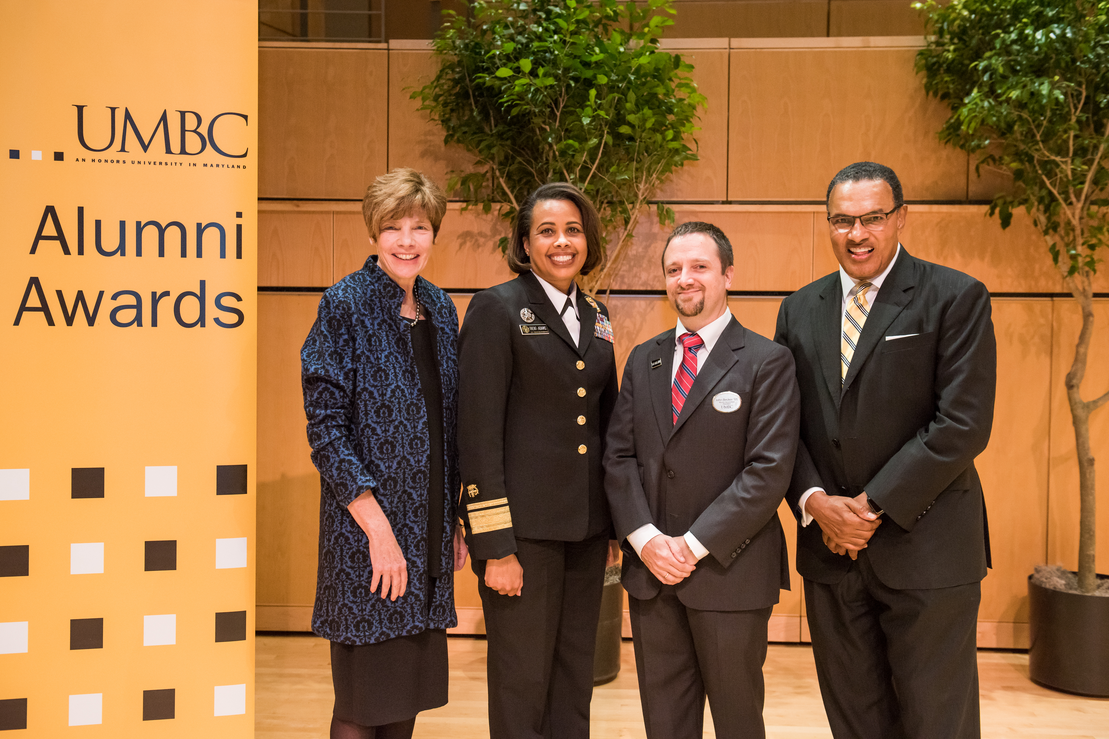 A group picture of Nancy Miller, Rear Admiral Sylvia Trent-Adams, and Freeman Hrabowski at the UMBC Alumni Awards 2017.