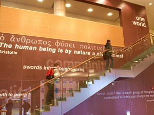 Photo of students walking up the stairs of the main lobby of the Public Policy building.