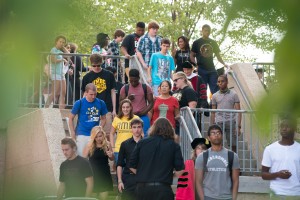 Photo of a crowd of students walking down stairs.